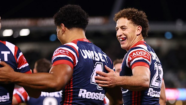 Mark Nawaqanitawase of the Roosters celebrates scoring a try.