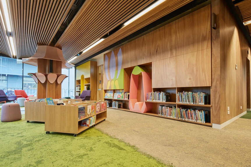 A brightly coloured kids area in a library.