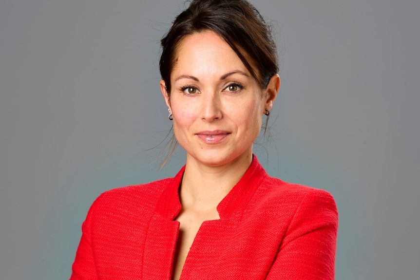 A woman in a red suit.