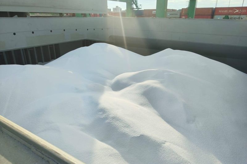 A big pile of white urea on a ship