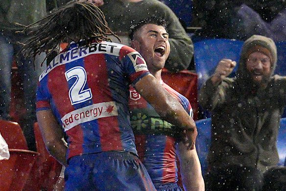 Dom Young, Bradman Best and a hardy fan celebrate Best’s match-winning try on Sunday.