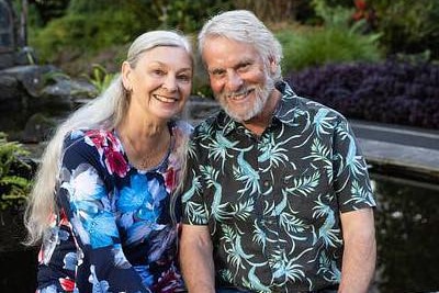 Two elderly people smiling