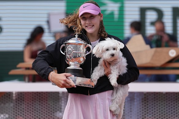 Andreeva brought her dog Rassy into her title celebrations.