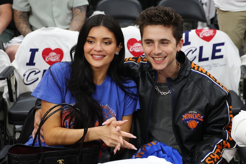 Kylie Jenner and Timothee Chalamet sitting courtside together