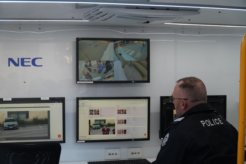 Police are monitoring through screens.