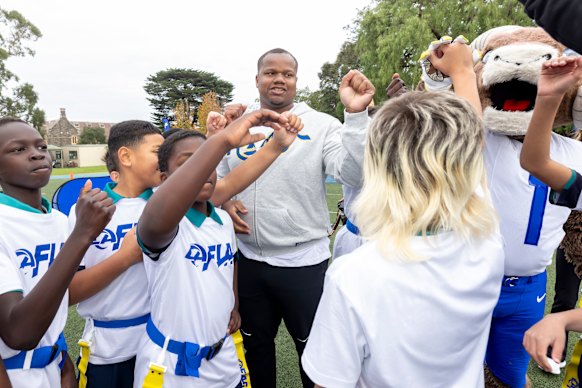 Tyler Davis gets involved with Kew schoolkids at a clinic this week.