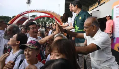 Home Affairs Minister K Shanmugam greeting participants during the brisk walk at the annual Healthy Living Festival @ North West on June 7.