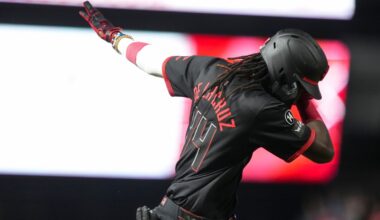 Cincinnati Reds' Elly De La Cruz gestures as he rounds the bases after hitting a solo home run during the sixth inning of a baseball game against the Chicago Cubs, Friday, Sept. 19, 2025, in Cincinnati. (AP Photo/Jeff Dean)