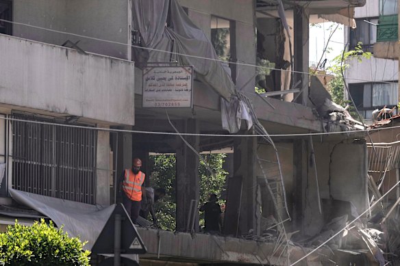 A rescue worker checks an apartment that was hit in an Israeli airstrike in Dahiyeh, in Beirut’s southern suburbs, on Sunday.