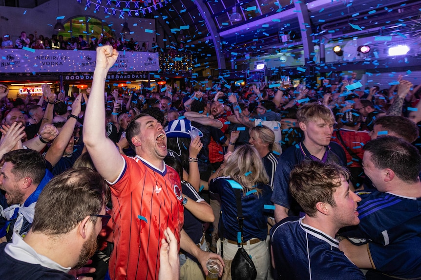 Scotland fans celebrate a goal at a World Cup live site