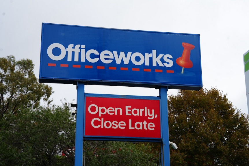 People walk past Officeworks
