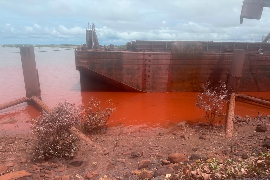 Discoloured water near a dock.