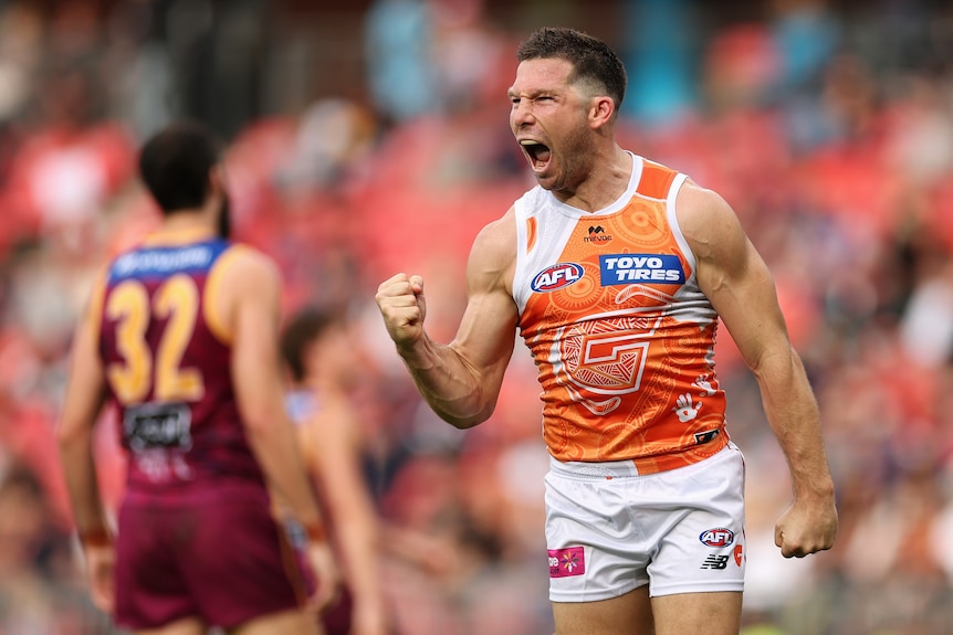 Toby Greene celebrates a goal against the Lions