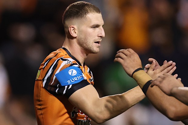 SYDNEY, AUSTRALIA - APRIL 23: Adam Doueihi of the Wests Tigers celebrates after scoring a try during the round eight NRL match between the Wests Tigers and Canberra Raiders at Leichhardt Oval on April 23, 2026 in Sydney, Australia. (Photo by Cameron Spencer/Getty Images)