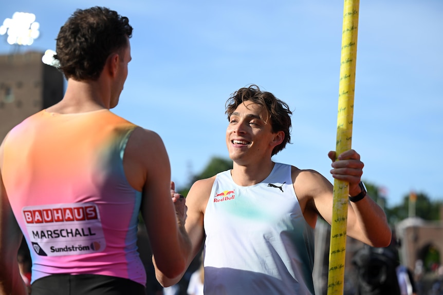 Armand Duplantis interacts with Kurtis Marschall at the Stockholm Diamond League meet.