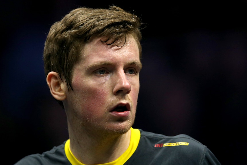 Greg Lobban looks to one side