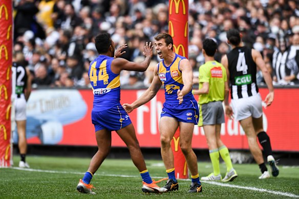 Jamie Cripps celebrates a goal with Willie Rioli in West Coast’s win over Collingwood in the 2018 grand final.