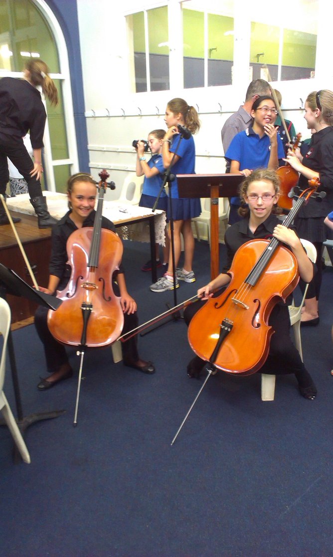 Ms Davies (right) playing cello at West Leederville Primary School in 2013.