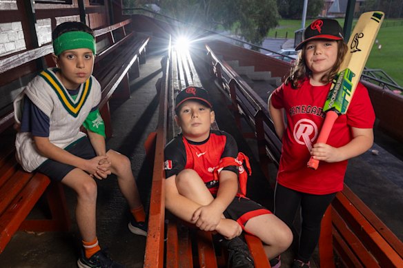Melbourne Stars fan Max (left) with Renegades supporters Toby and Phoebe.