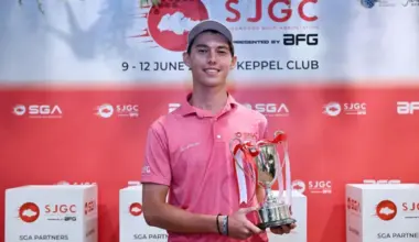 Singapore's Troy Storm holds the Singapore Junior Golf Championship A Boys strokeplay trophy after delivering an eight-stroke victory with a 17-under score of 199.