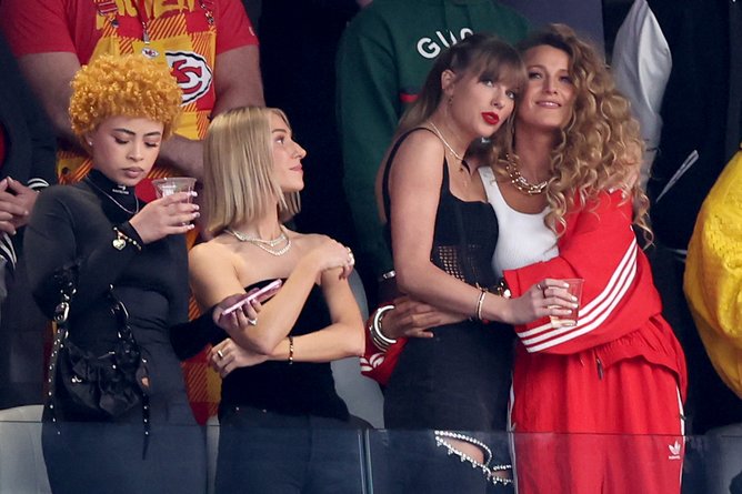 LAS VEGAS, NEVADA - FEBRUARY 11: Singer Taylor Swift and Actress Blake Lively hug prior to Super Bowl LVIII between the San Francisco 49ers and Kansas City Chiefs at Allegiant Stadium on February 11, 2024 in Las Vegas, Nevada. (Photo by Steph Chambers/Getty Images)