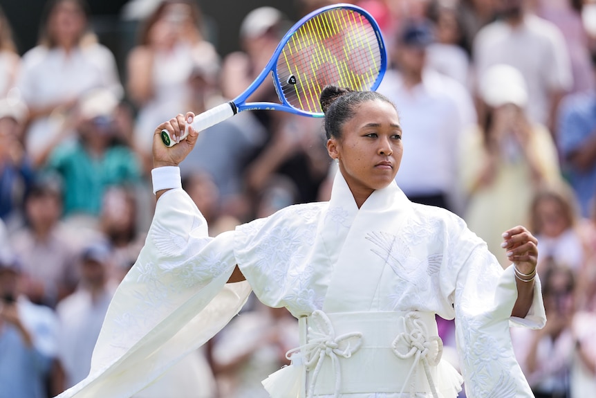 Naomi Osaka warms up in her kimono at Wimbledon.