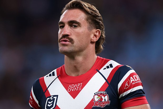 Connor Watson of the Roosters warms up.