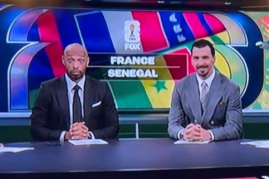 Thierry Henry sits next to Zlatan Ibrahimovic and Alexi Lalas in the Fox Studio.