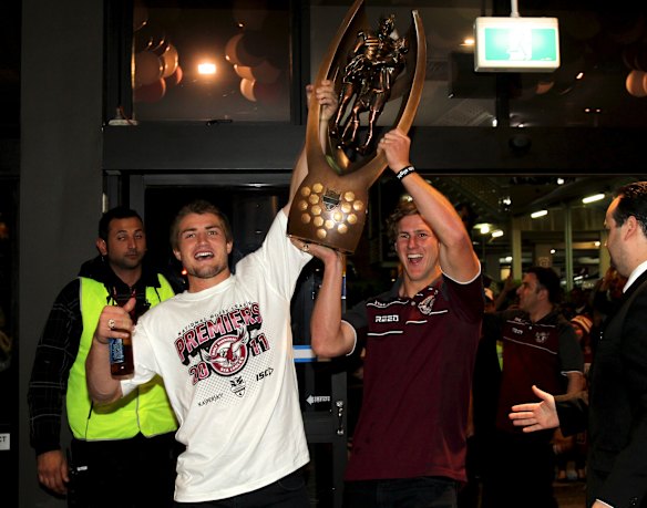 Kieran Foran and Daly Cherry-Evans arrive at the Manly Leagues Club with the NRL trophy in 2011.
