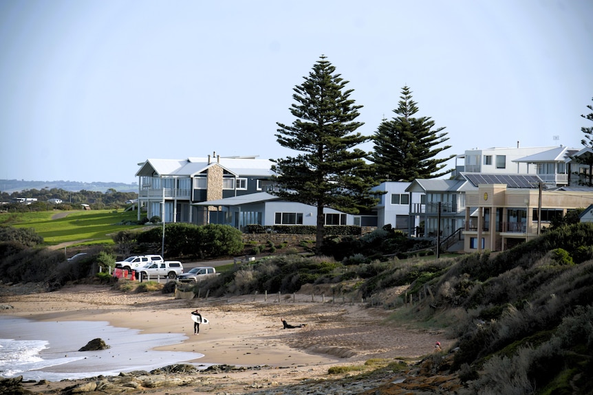 The beach with large house overlooking them