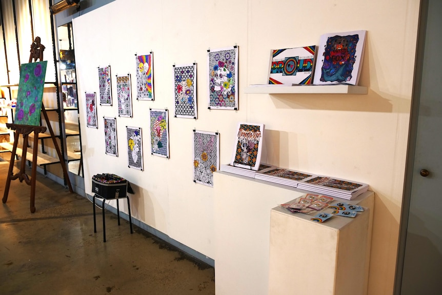Several colourful abstract artworks on a wall