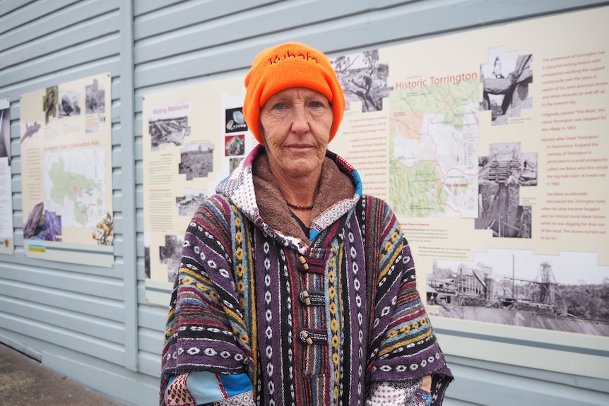 Woman wearing beanie looking at camera