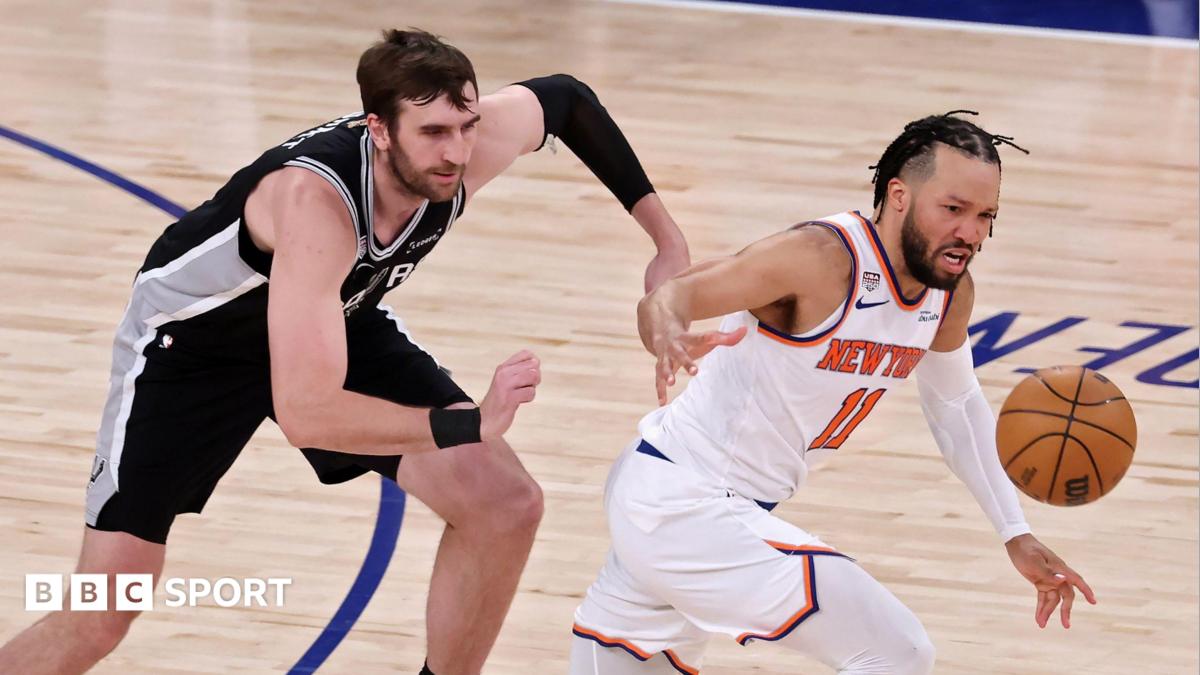 The San Antonio Spurs' Luke Kornet chases the New York Knicks' Jalen Brunson