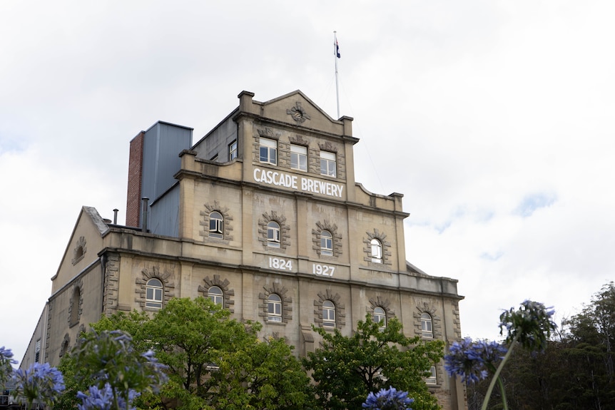 The sandstone facade of the brewery with white signage that reads 'Cascade Brewery 1824 1927'