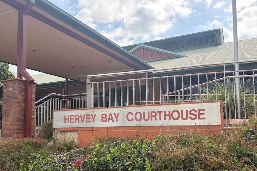 A brick building with a sign out the front reading 'Hervey Bay Courthouse'
