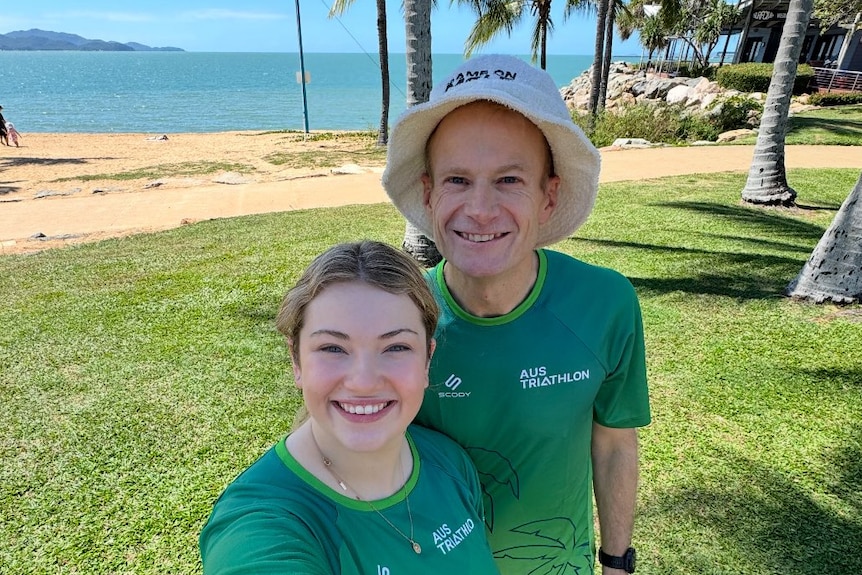 Professor Richard Scolyer and eldest daughter Emily smile at the camera as they take a selfie.