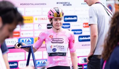 Van der Breggen in the pink jersey descends from the podium