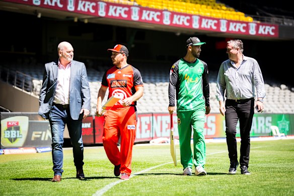 Jason Dunstall (left) and Eddie McGuire (right) in 2019 in their days as chairmen of the two Melbourne BBL teams with their captains Aaron Finch (Renegades) and Glenn Maxwell (Stars).