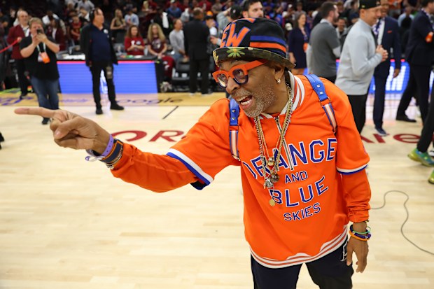 Filmmaker and actor Spike Lee celebrates after the New York Knicks defeat the Cleveland Cavaliers.
