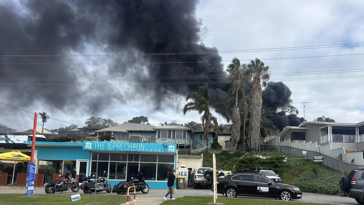 Thick smoke covers sky as backyard shed in Dawesville goes up in flames