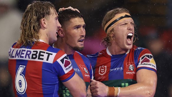 The Knights celebrate Dylan Lucas’ try.