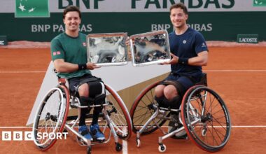 Gordon Reid of Great Britain and Alfie Hewett of Great Britain pose for a photo with their Men's Wheelchair Doubles Trophies