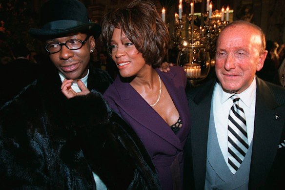 Bobby Brown, Whitney Houston and Clive Davis at a pre-Grammy party in New York in 1998.