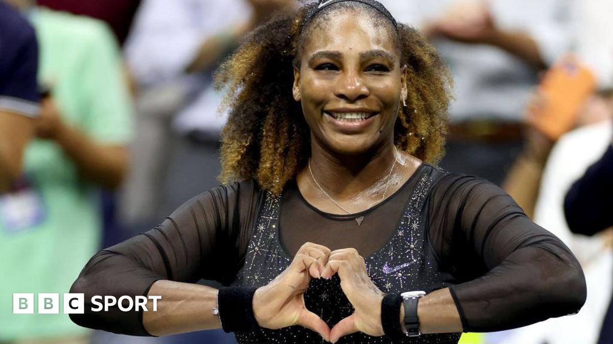 Serena Williams does a heart symbol with her hands while playing at the 2022 US Open