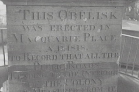 A black and white photo of the obelisk at Macquarie Park.