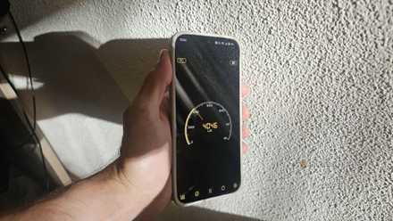 A phone measuring luminance, pointed towards the sun.