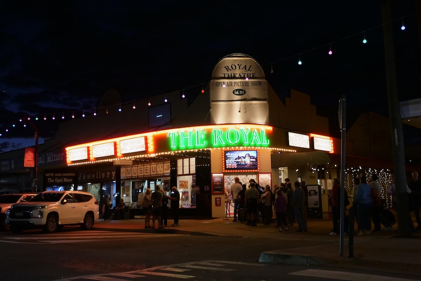 The Royal Theatre at night with the lights turned on.