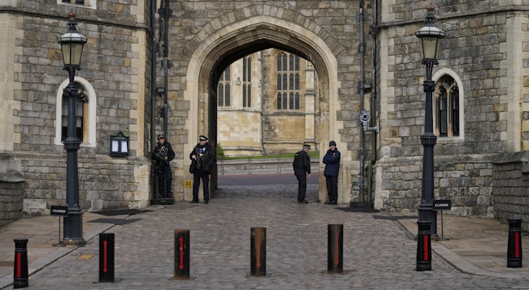 police guard the gate to windsor castle