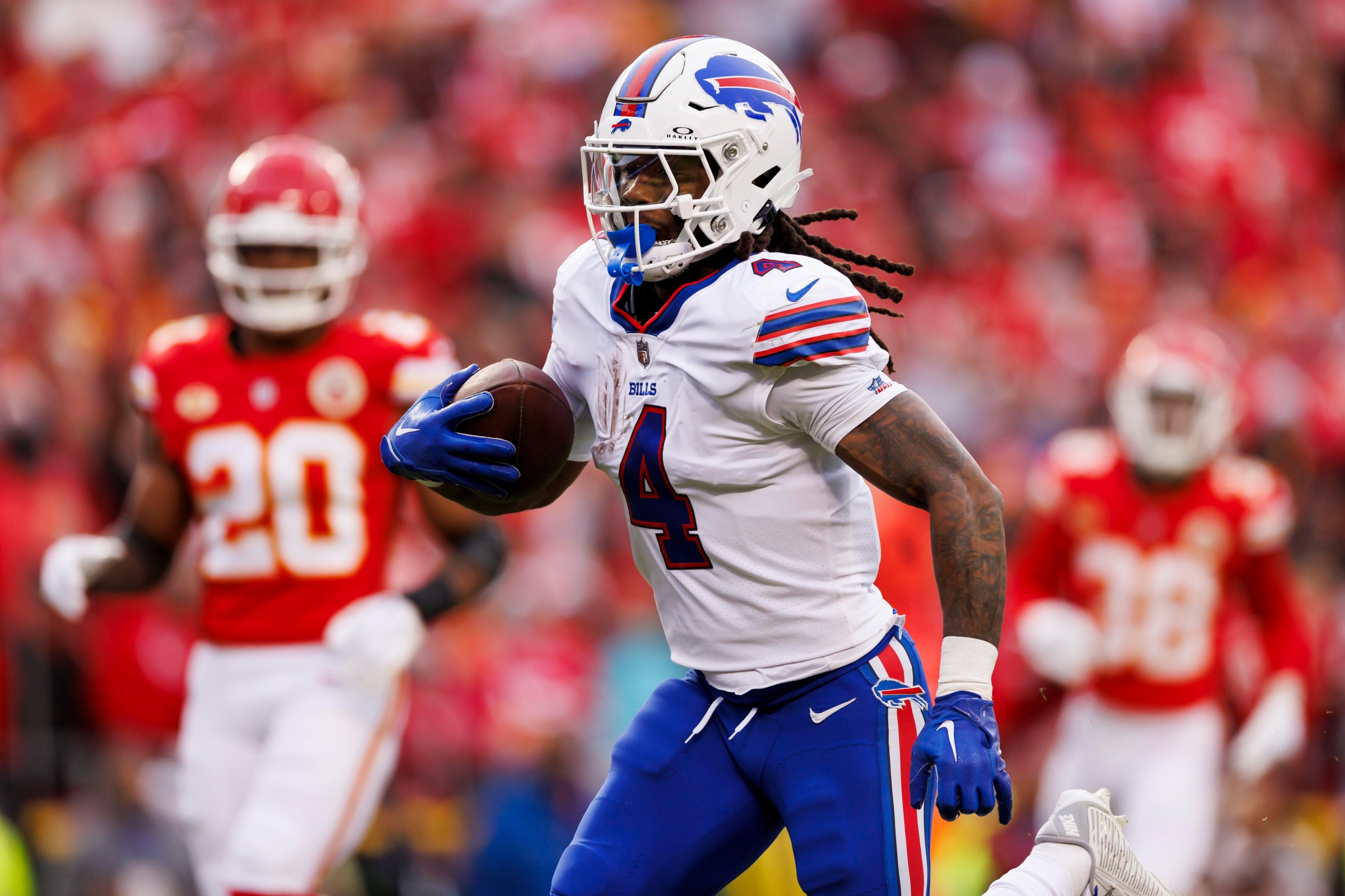 KANSAS CITY, MISSOURI - DECEMBER 10: James Cook #4 of the Buffalo Bills carries the ball on a run play to score a touchdown during an NFL football game against the Kansas City Chiefs at GEHA Field at Arrowhead Stadium on December 10, 2023 in Kansas City, Missouri. (Photo by Ryan Kang/Getty Images)