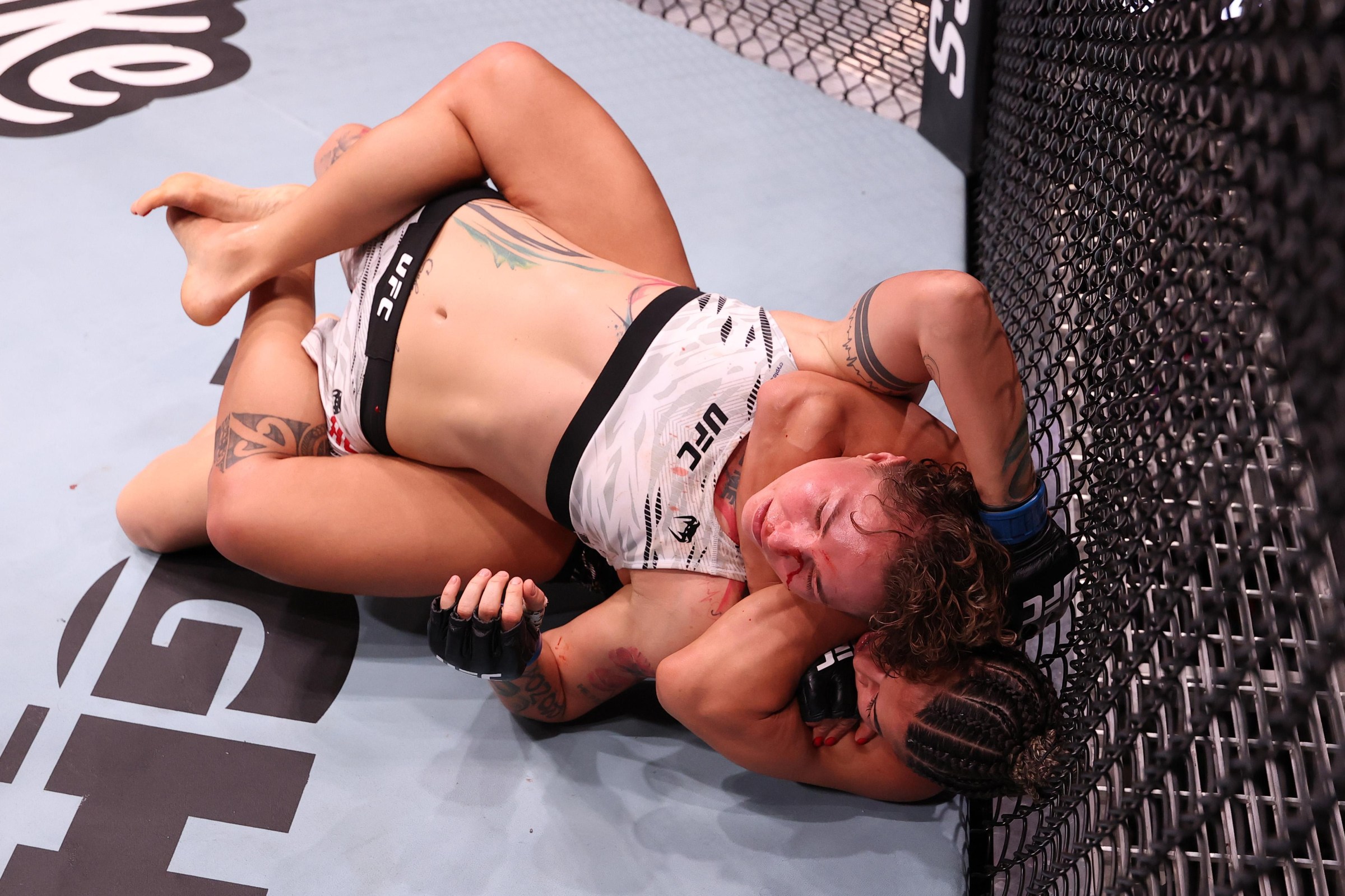 RIO DE JANEIRO, BRAZIL - OCTOBER 11: Bia Mesquita of Brazil secures a rear choke submission against Irina Alekseeva of Kazakstan in a bantamweight fight during the UFC Fight Night event at Farmasi Arena on October 11, 2025 in Rio de Janeiro, Brazil. (Photo by Ed Mulholland/Zuffa LLC)